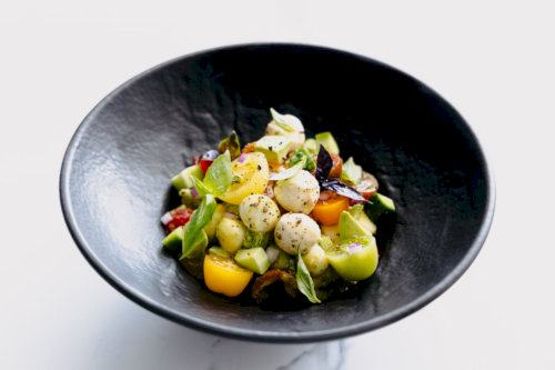 Delicious summer salad with vegetables and mozarella