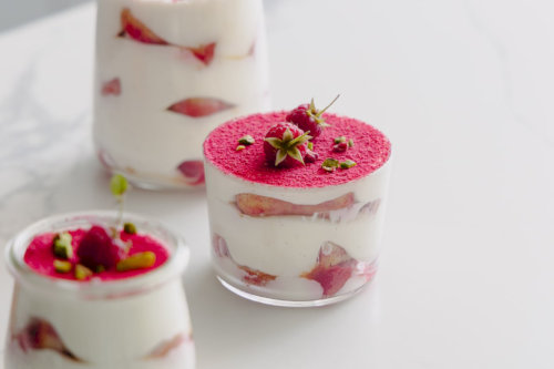 Tiramisu portioned with raspberries